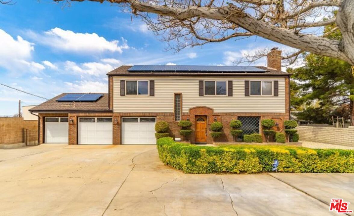 Attached, Exterior, Facade, Brick Facade, Solar Panels, Raised Ranch