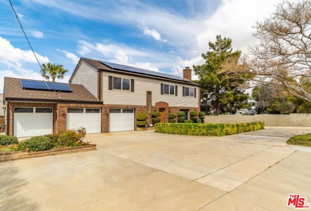 Attached, Exterior, Facade, Brick Facade, Solar Panels, Raised Ranch