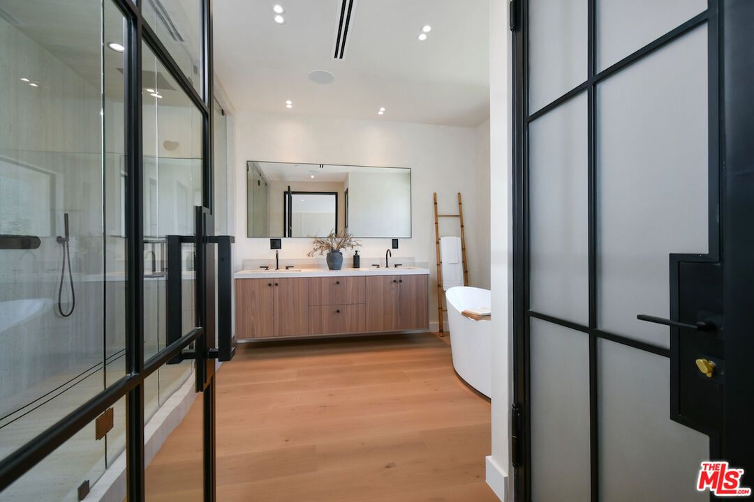 Bathroom, Dual Sink Vanities, Free Standing Baths, Glass Shower, Interior, Recessed Lighting, Wood Texture Flooring