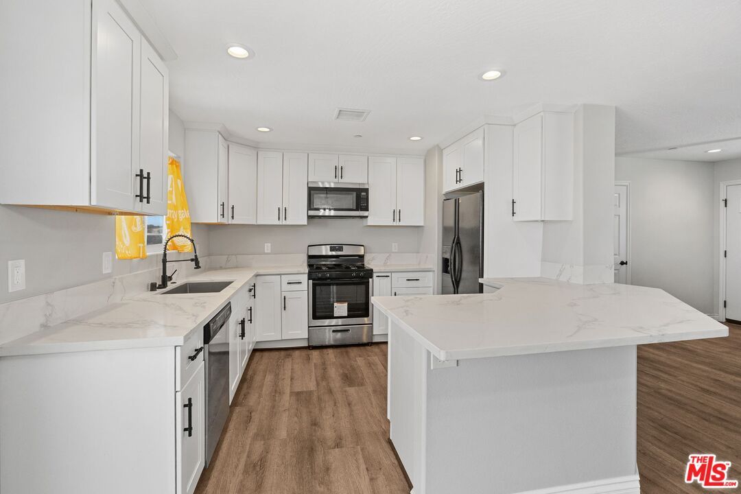 Interior, Kitchen, Recessed Lighting, Stainless Steel Appliances, Wood Texture Flooring