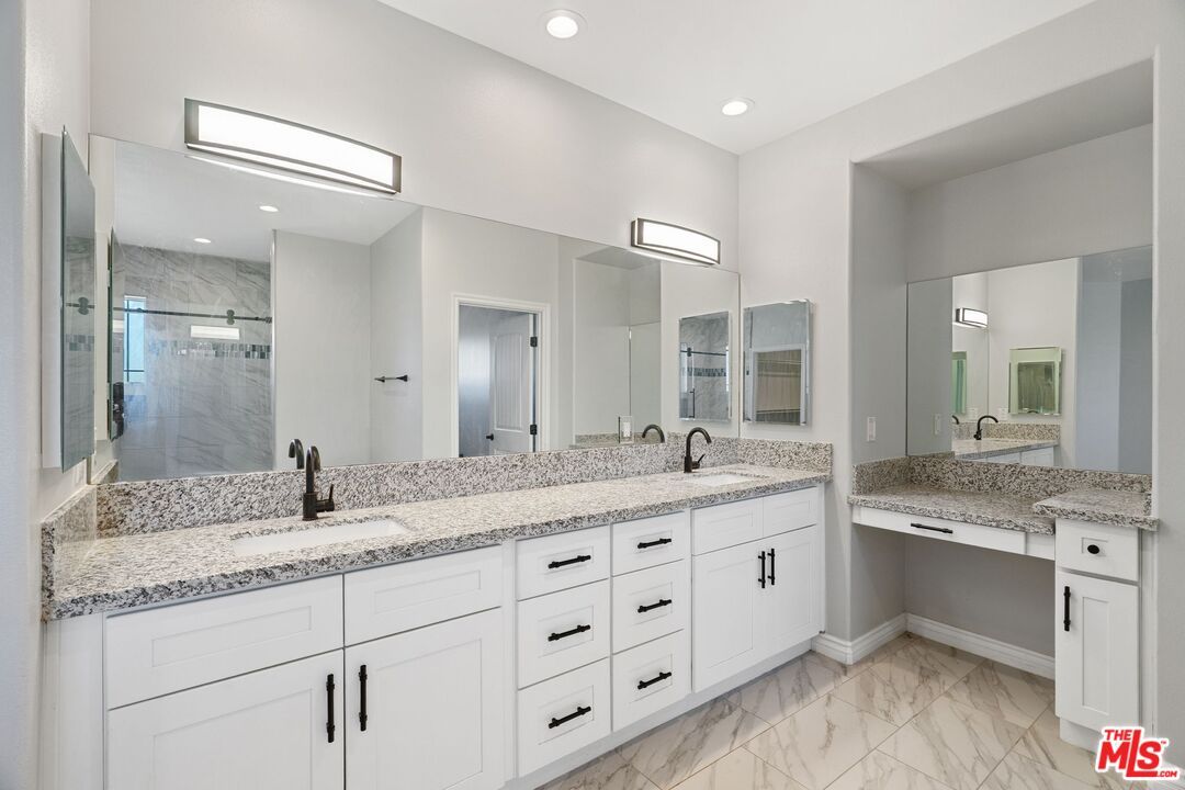 Bathroom, Dual Sink Vanities, Glass Shower, Interior, Marble, Marble Walls, Recessed Lighting