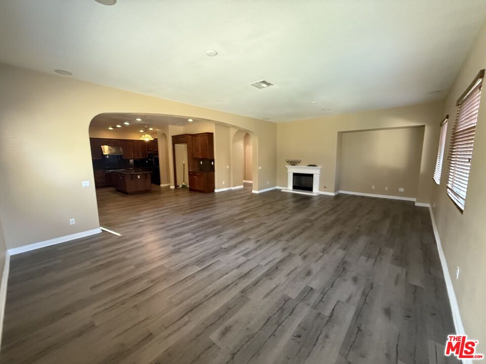 Empty room, Fireplace, Interior, Kitchen, Recessed Lighting, Wood Texture Flooring
