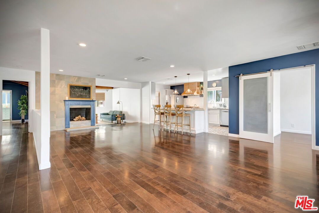 Dining room, Empty room, Fireplace, Interior, Kitchen, Pendant Lights, Recessed Lighting, Wood Texture Flooring