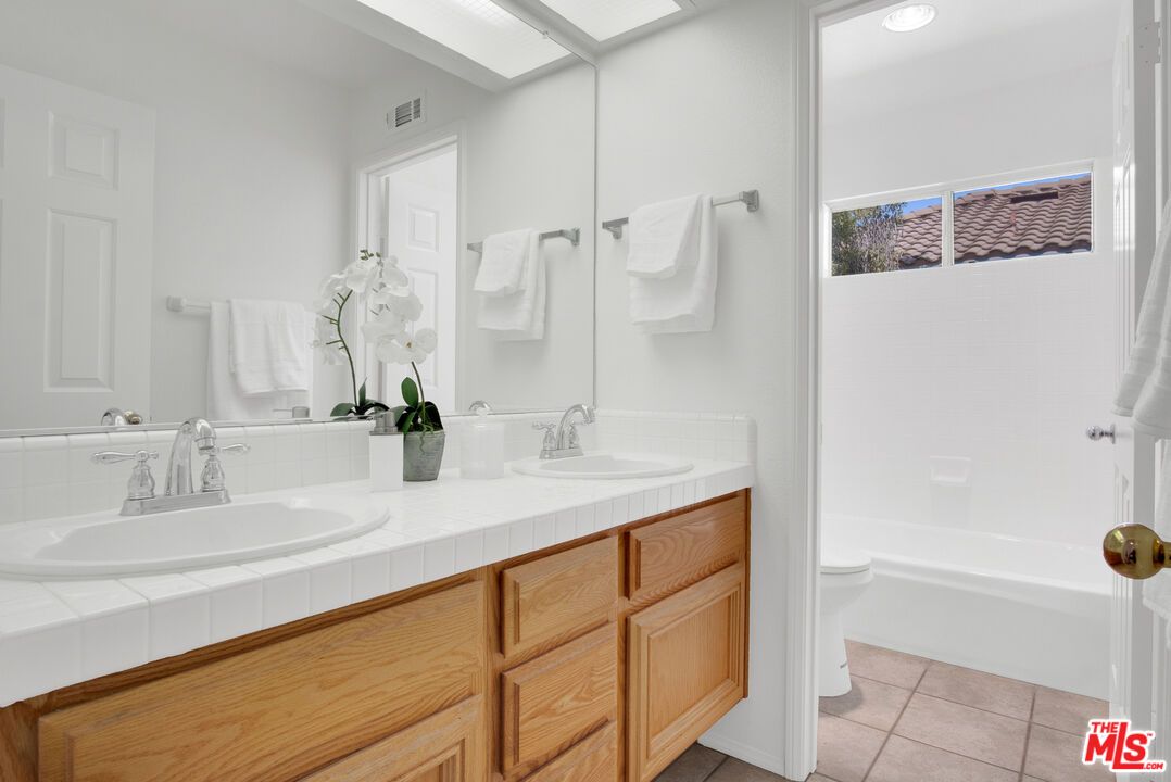 Bathroom, Dual Sink Vanities, Interior, Recessed Lighting, Tile Countertops