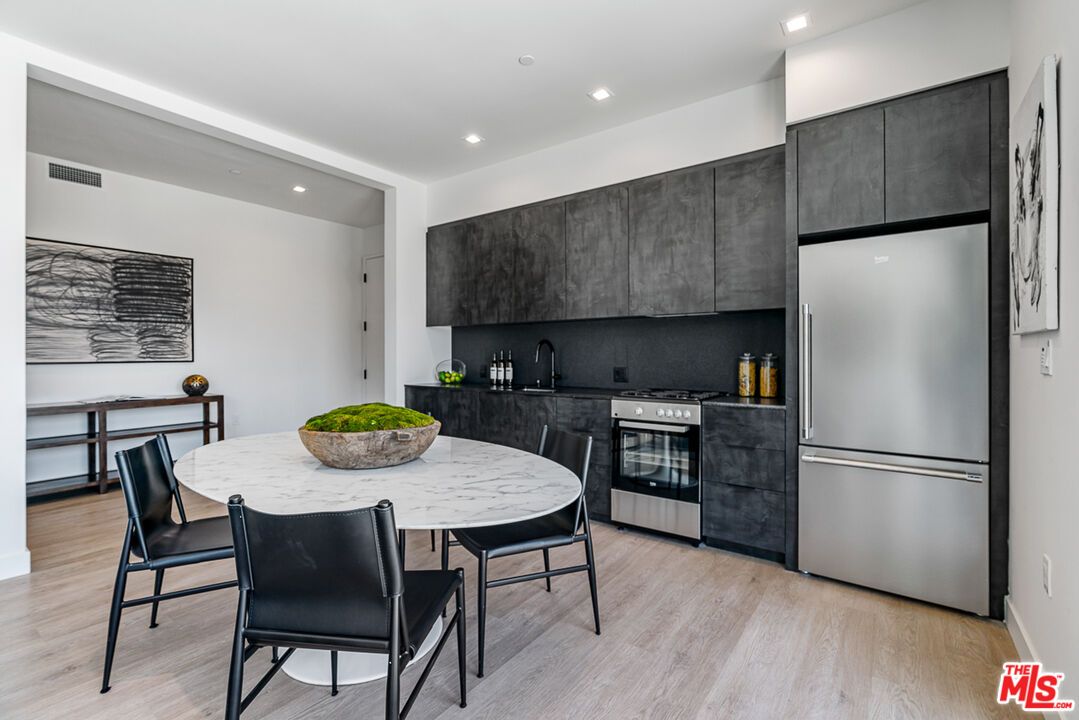 Dining room, Interior, Kitchen, Recessed Lighting, Stainless Steel Appliances, Wood Texture Flooring