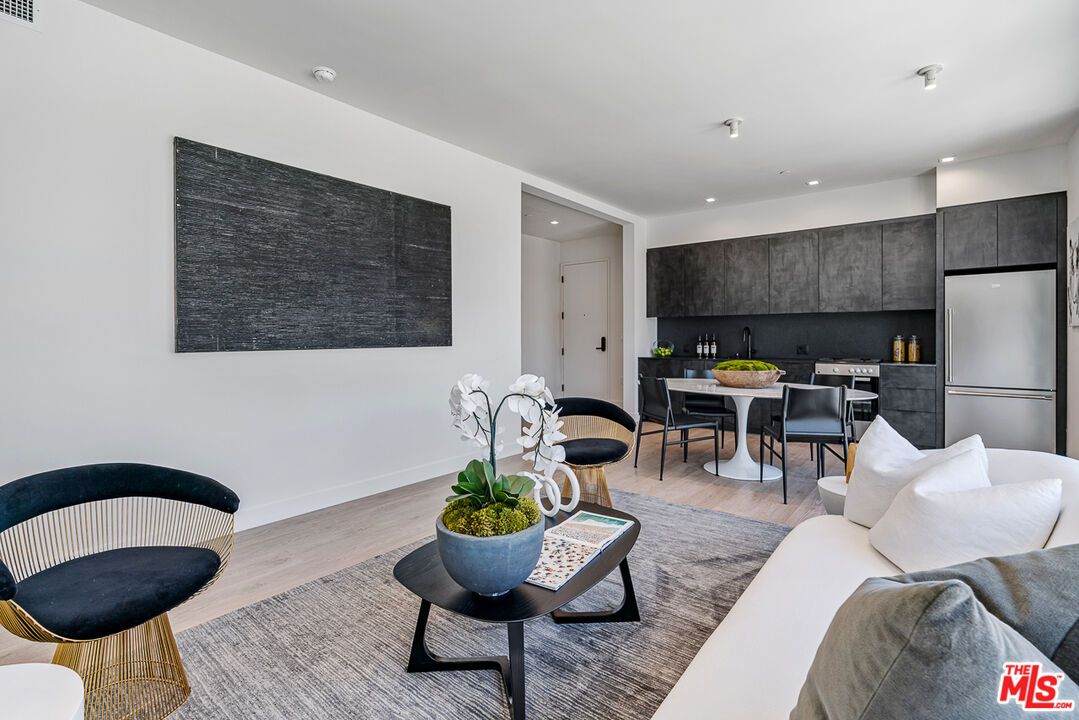 Dining room, Interior, Kitchen, Living room, Recessed Lighting, Stainless Steel Appliances, Wood Texture Flooring