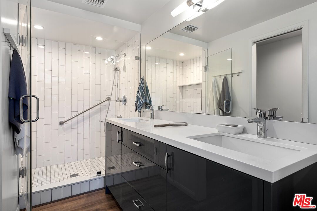 Bathroom, Dual Sink Vanities, Glass Shower, Interior, Recessed Lighting, Wood Texture Flooring