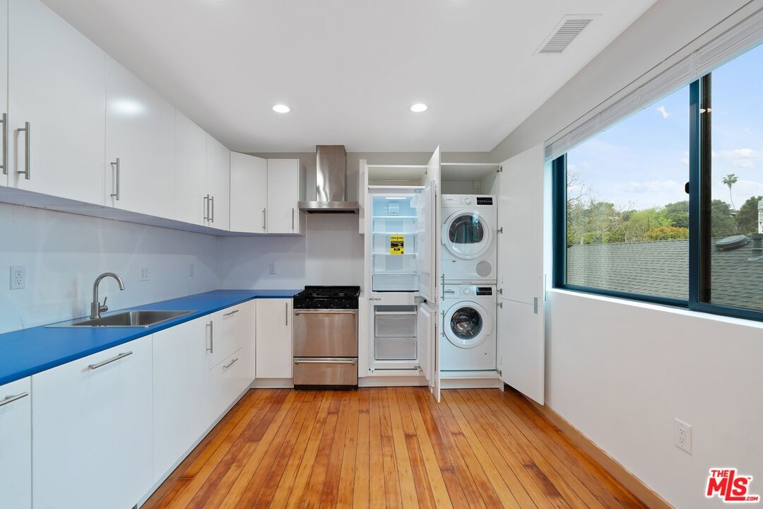 Interior, Kitchen, Recessed Lighting, Stainless Steel Appliances, Washer, Wood Texture Flooring