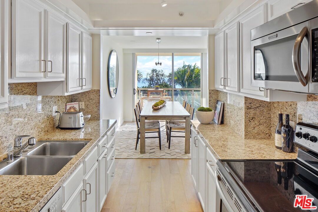 Dining room, Interior, Kitchen, Pendant Lights, Recessed Lighting, Stainless Steel Appliances, Water, Wood Texture Flooring