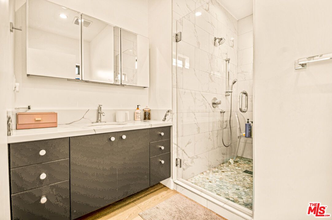 Bathroom, Glass Shower, Interior, Marble Walls, Recessed Lighting, Wood Texture Flooring