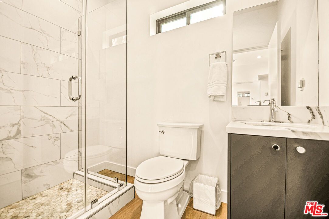 Bathroom, Glass Shower, Interior, Marble Walls, Wood Texture Flooring