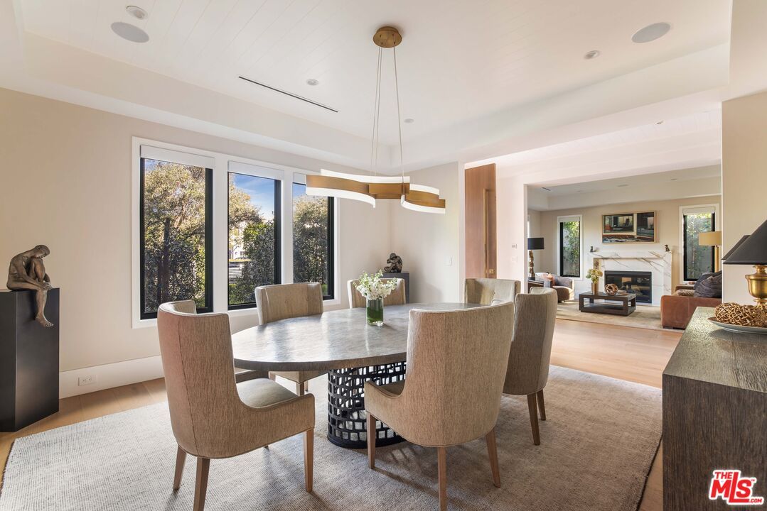 Dining room, Fireplace, Interior, Living room, Pendant Lights, Recessed Lighting, Wood Texture Flooring