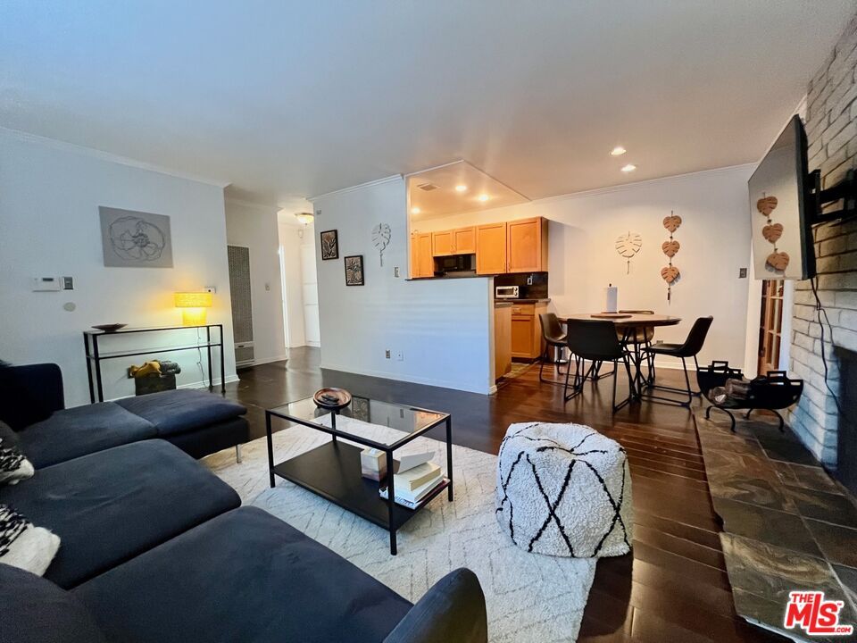 Dining room, Fireplace, Interior, Kitchen, Living room, Recessed Lighting, Stone Walls, Wood Texture Flooring