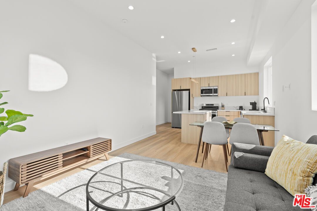 Dining room, Interior, Kitchen, Pendant Lights, Recessed Lighting, Stainless Steel Appliances, Wood Texture Flooring