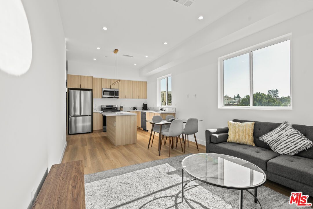 Dining room, Interior, Kitchen, Living room, Pendant Lights, Recessed Lighting, Stainless Steel Appliances, Wood Texture Flooring