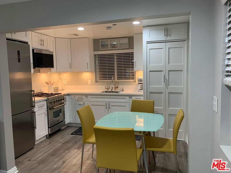Dining room, Interior, Kitchen, Recessed Lighting, Stainless Steel Appliances, Wood Texture Flooring