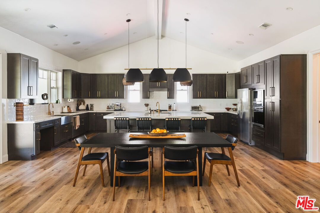 Dining room, Interior, Kitchen, Pendant Lights, Recessed Lighting, Stainless Steel Appliances, Wood Texture Flooring