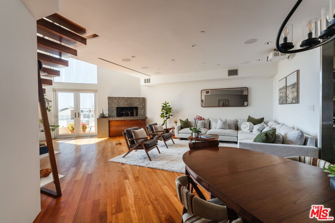 Dining room, Fireplace, Interior, Living room, Recessed Lighting, Wood Texture Flooring