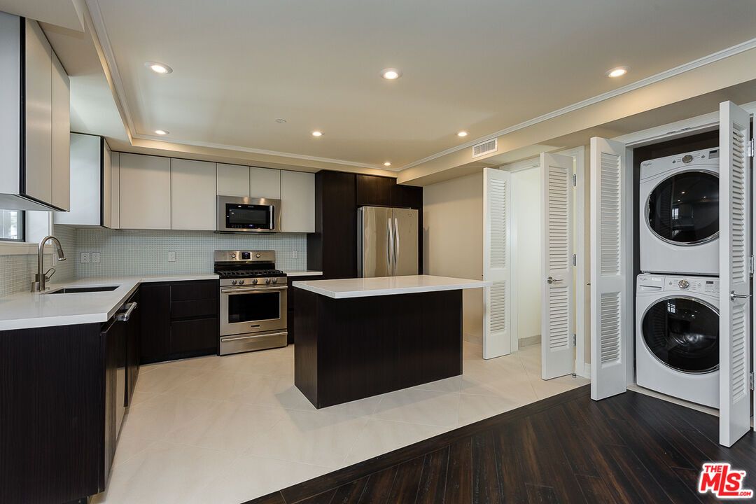 Interior, Kitchen, Recessed Lighting, Stainless Steel Appliances, Washer, Wood Texture Flooring