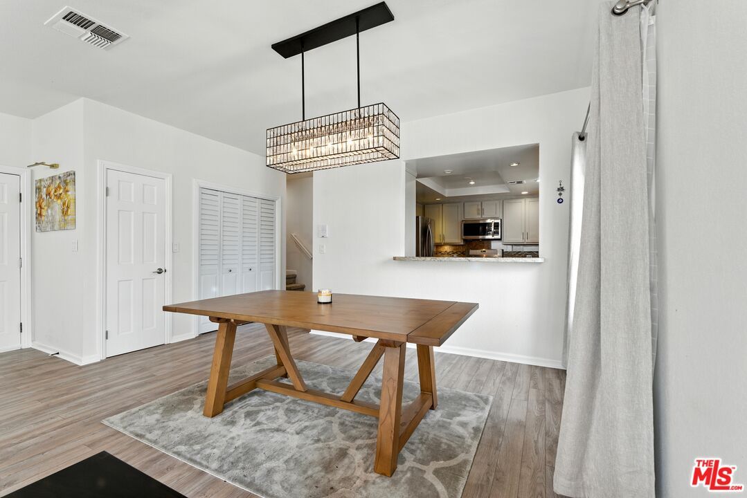 Chandelier, Interior, Kitchen, Pendant Lights, Recessed Lighting, Stainless Steel Appliances, Wood Texture Flooring