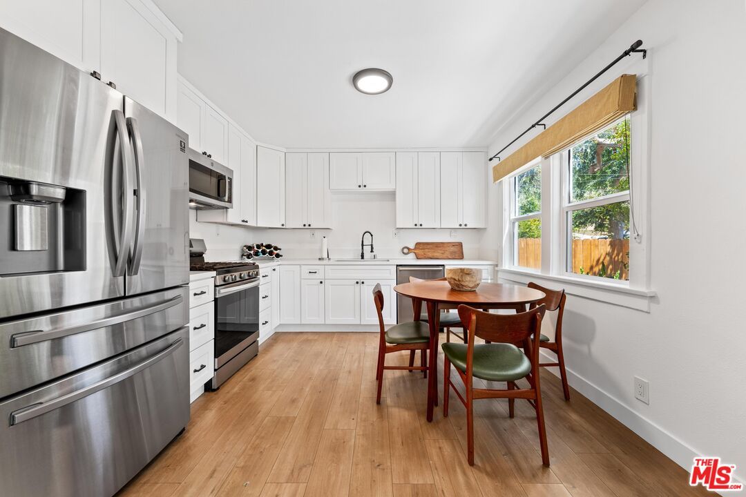 Dining room, Interior, Kitchen, Recessed Lighting, Stainless Steel Appliances, Wood Texture Flooring