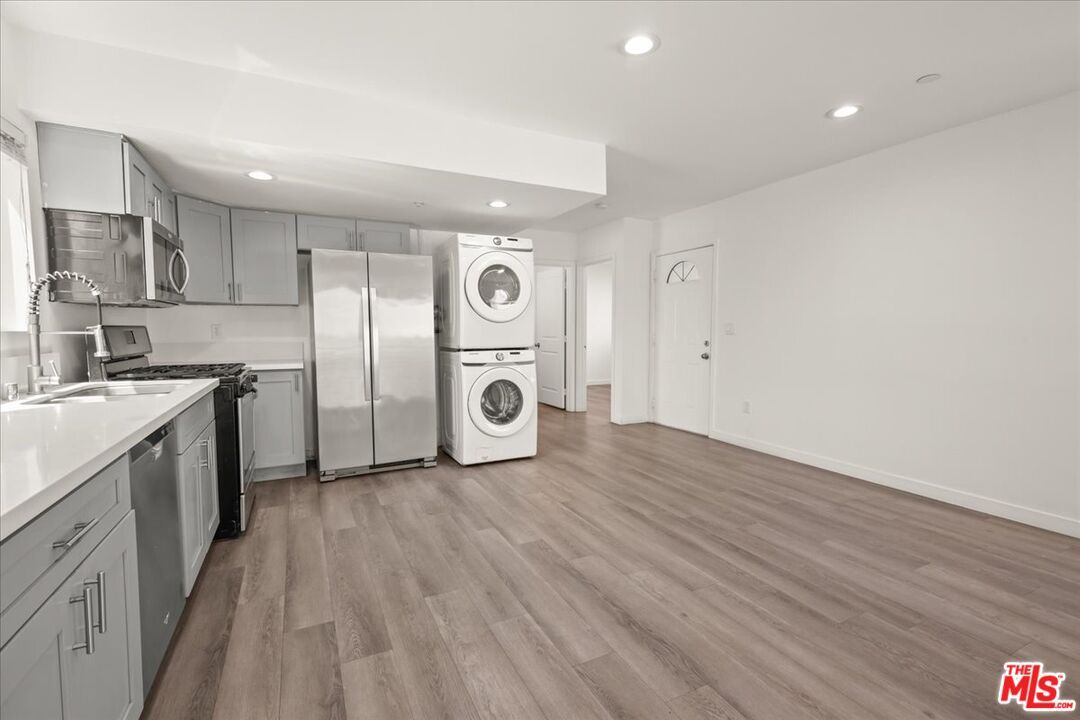 Interior, Kitchen, Recessed Lighting, Stainless Steel Appliances, Washer, Wood Texture Flooring