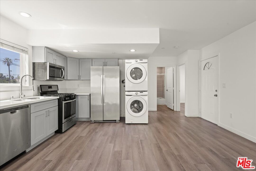 Interior, Kitchen, Recessed Lighting, Stainless Steel Appliances, Washer, Wood Texture Flooring