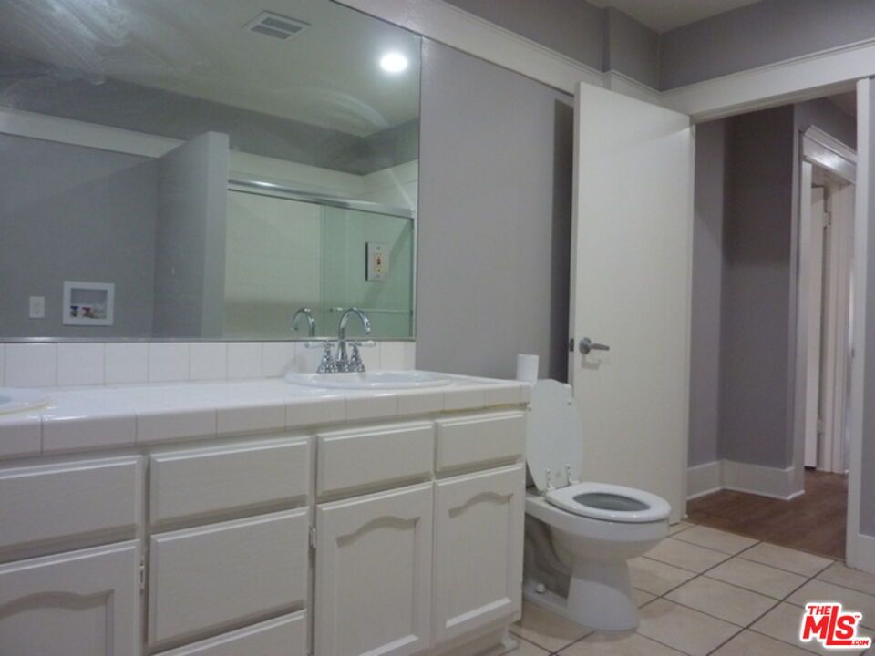 Bathroom, Interior, Recessed Lighting, Tile Countertops, Wood Texture Flooring