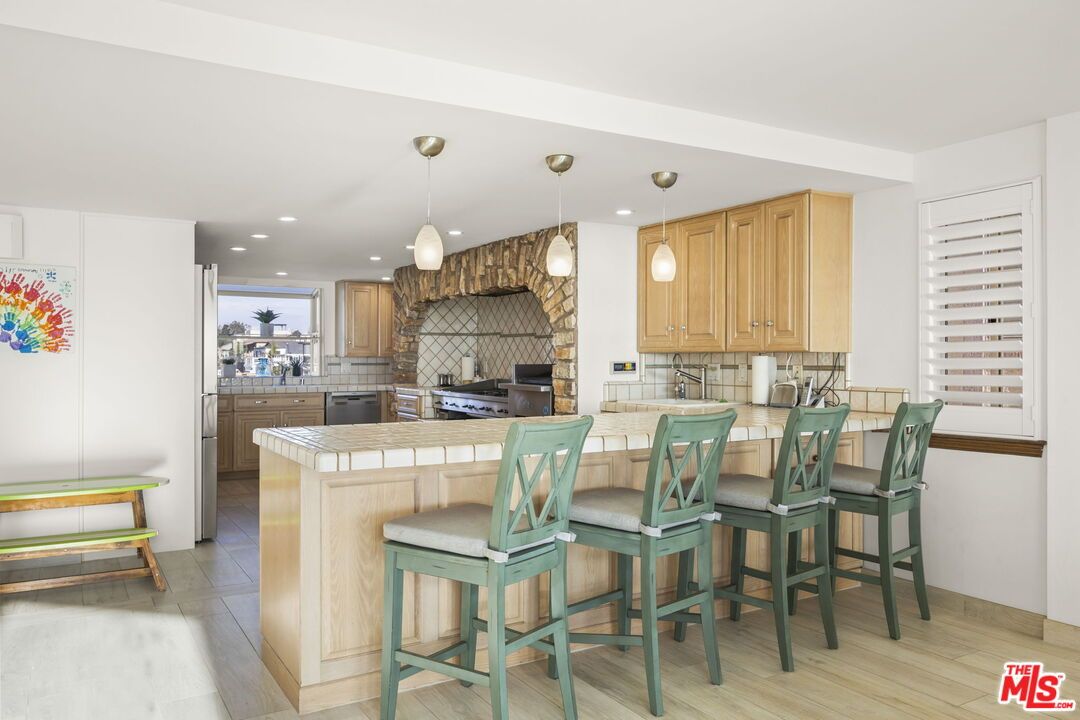 Interior, Kitchen, Pendant Lights, Recessed Lighting, Tile Countertops, Wood Texture Flooring