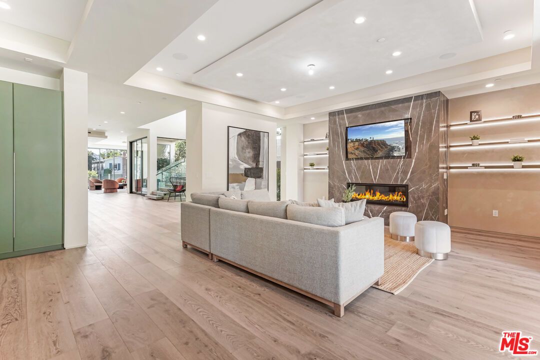 Fireplace, Interior, Living room, Marble Walls, Recessed Lighting, Wood Texture Flooring