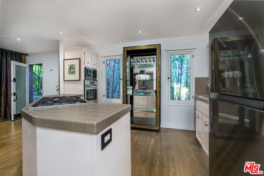 Interior, Kitchen, Recessed Lighting, Stainless Steel Appliances, Tile Countertops, Wood Texture Flooring