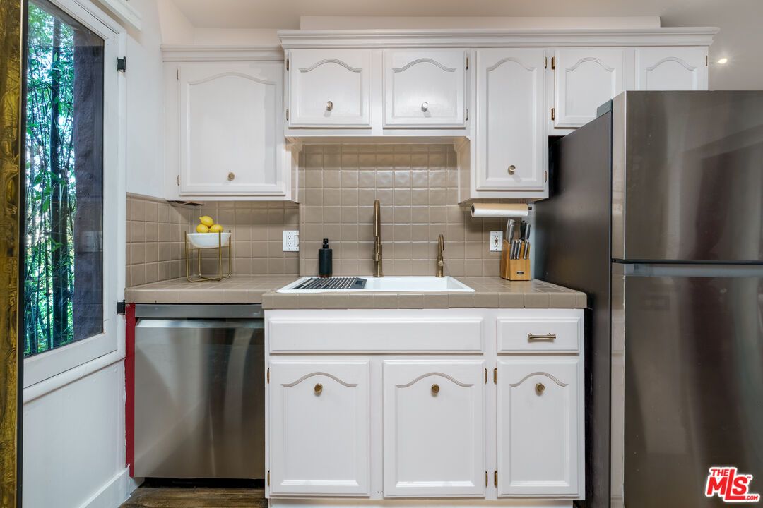 Interior, Kitchen, Recessed Lighting, Stainless Steel Appliances, Tile Countertops, Wood Texture Flooring