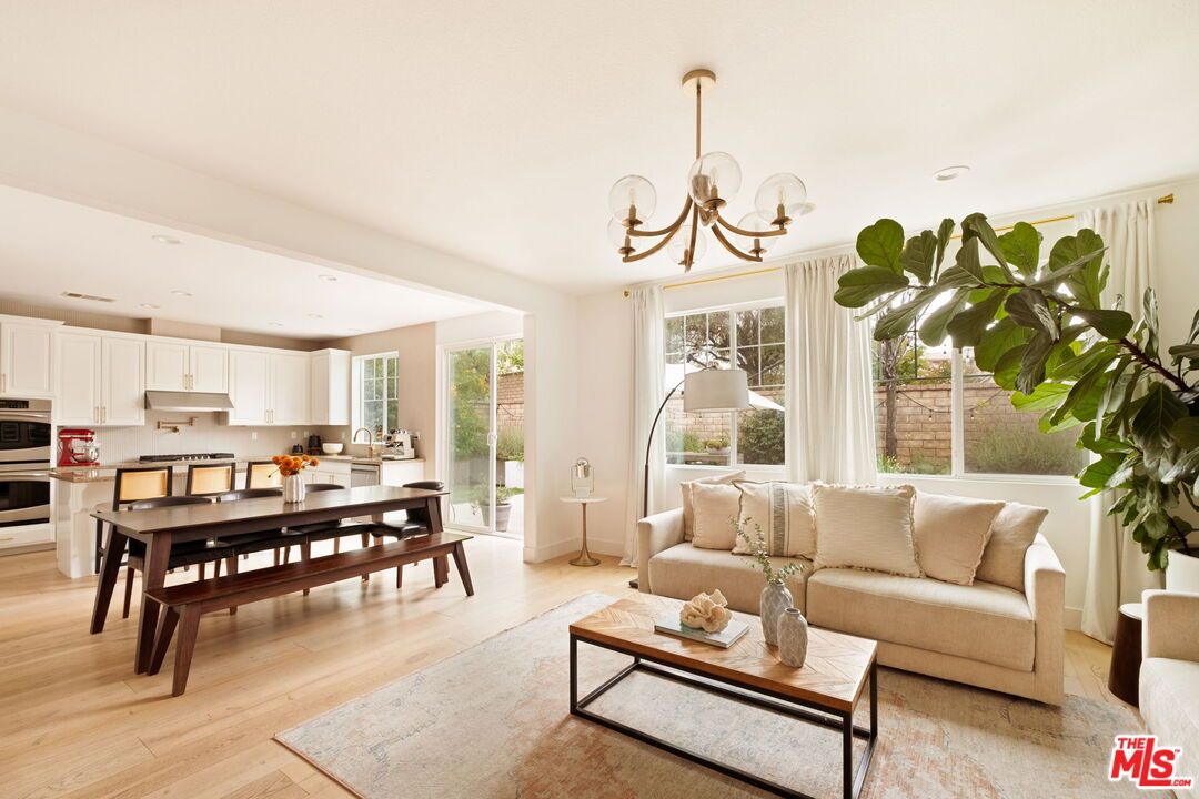 Chandelier, Dining room, Interior, Kitchen, Living room, Recessed Lighting, Stainless Steel Appliances, Wood Texture Flooring