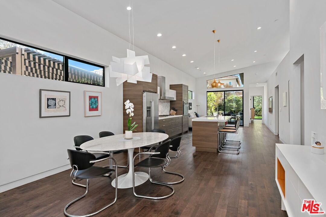 Dining room, Interior, Kitchen, Pendant Lights, Recessed Lighting, Stainless Steel Appliances, Wood Texture Flooring
