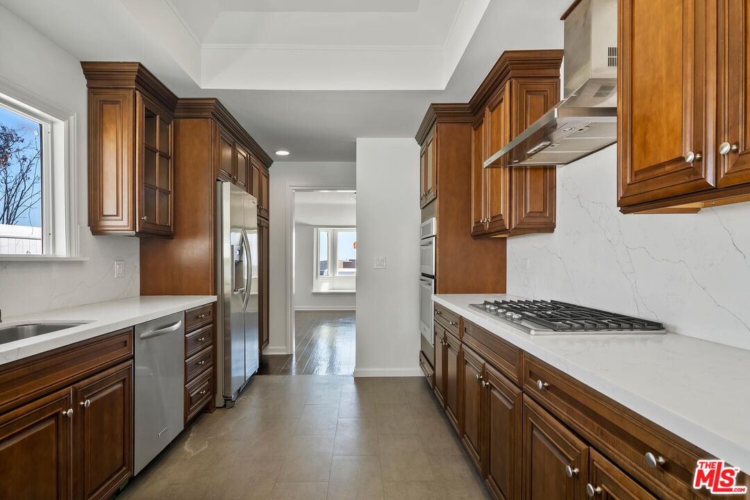 Interior, Kitchen, Marble Walls, Recessed Lighting, Stainless Steel Appliances