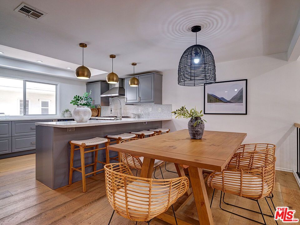 Dining room, Interior, Kitchen, Pendant Lights, Recessed Lighting, Stainless Steel Appliances, Wood Texture Flooring