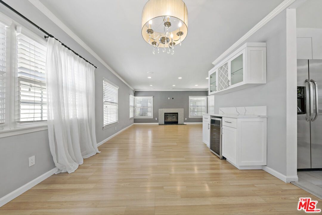 Chandelier, Empty room, Fireplace, Interior, Kitchen, Recessed Lighting, Wood Texture Flooring