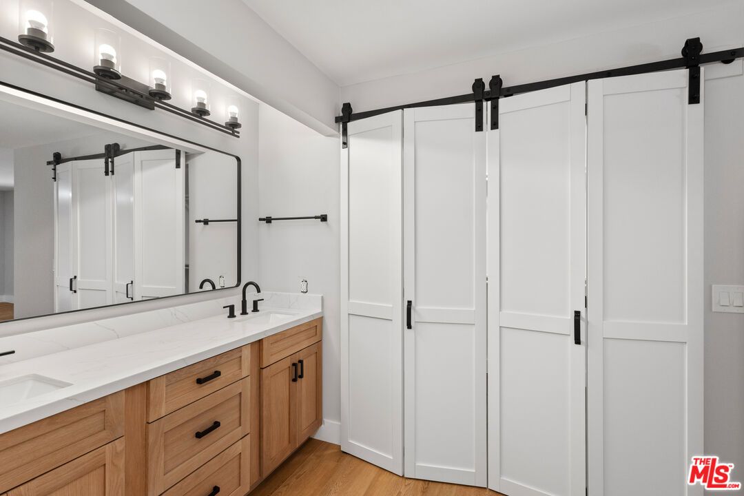 Bathroom, Dual Sink Vanities, Glass Shower, Interior, Wood Texture Flooring