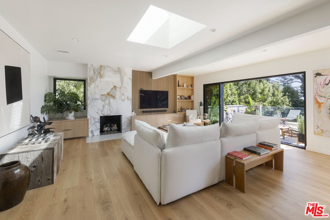 Fireplace, Interior, Living room, Marble Walls, Recessed Lighting, Wood Texture Flooring