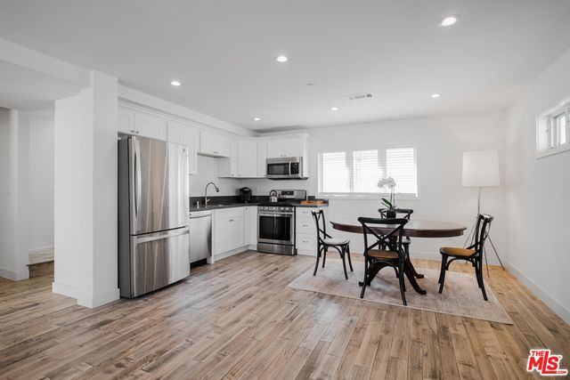 Dining room, Interior, Kitchen, Recessed Lighting, Stainless Steel Appliances, Wood Texture Flooring