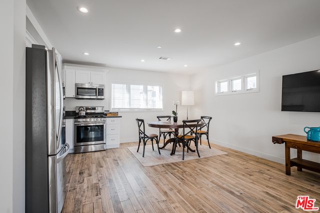 Dining room, Interior, Kitchen, Recessed Lighting, Stainless Steel Appliances, Wood Texture Flooring