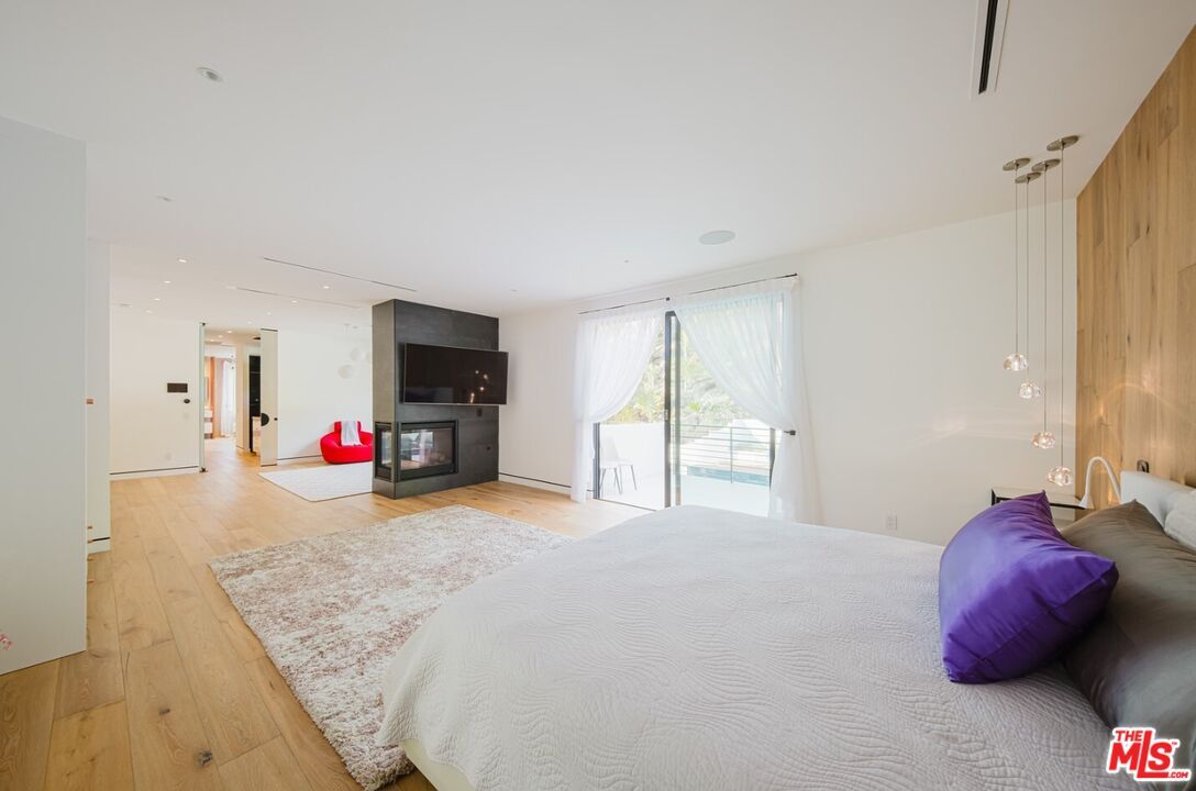 Bedroom, Fireplace, Interior, Pendant Lights, Recessed Lighting, Wood Texture Flooring