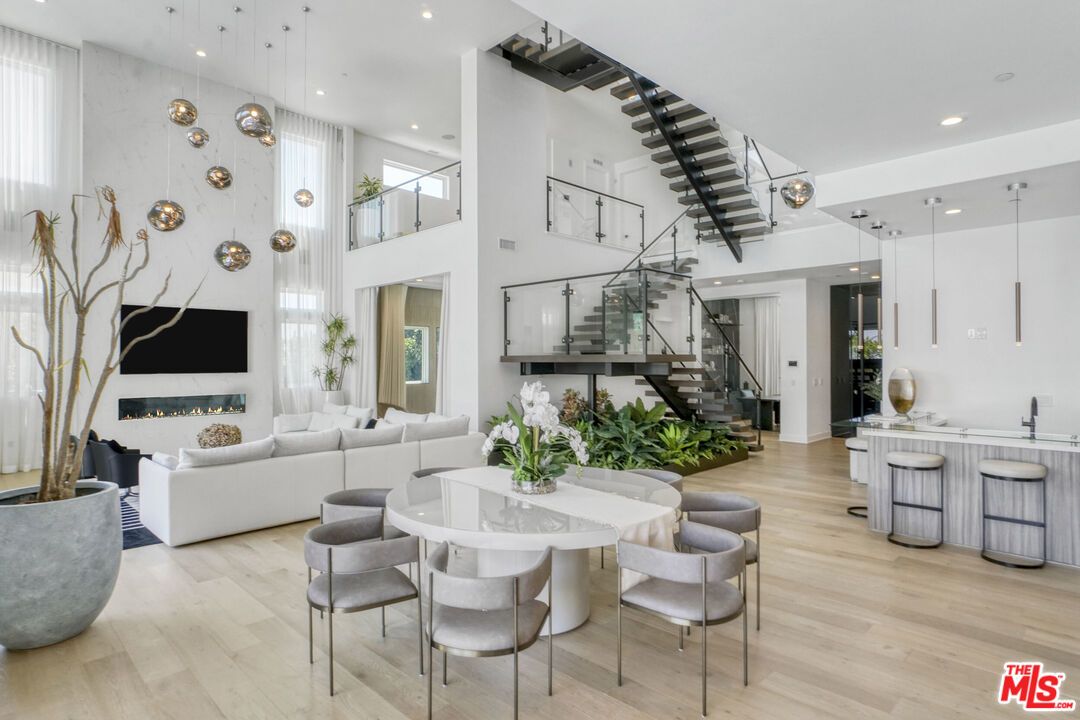 Dining room, Fireplace, Interior, Living room, Pendant Lights, Recessed Lighting, Wood Texture Flooring