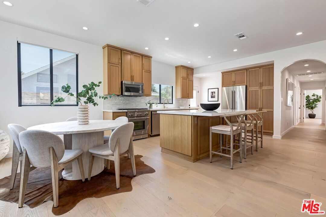 Dining room, Interior, Kitchen, Recessed Lighting, Stainless Steel Appliances, Wood Texture Flooring