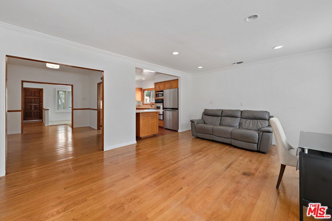 Empty room, Interior, Kitchen, Recessed Lighting, Stainless Steel Appliances, Wood Texture Flooring