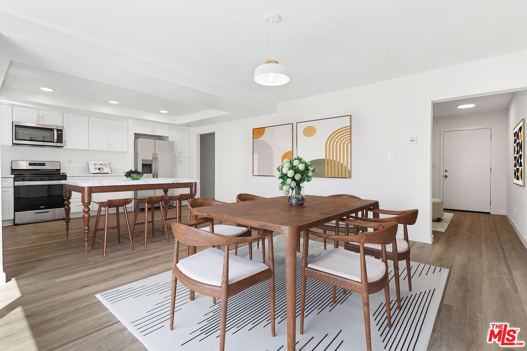 Dining room, Interior, Kitchen, Pendant Lights, Recessed Lighting, Stainless Steel Appliances, Wood Texture Flooring