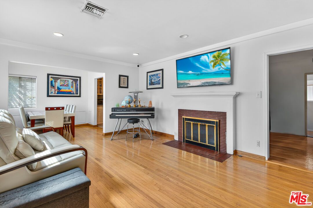 Dining room, Fireplace, Interior, Piano, Recessed Lighting, Wood Texture Flooring