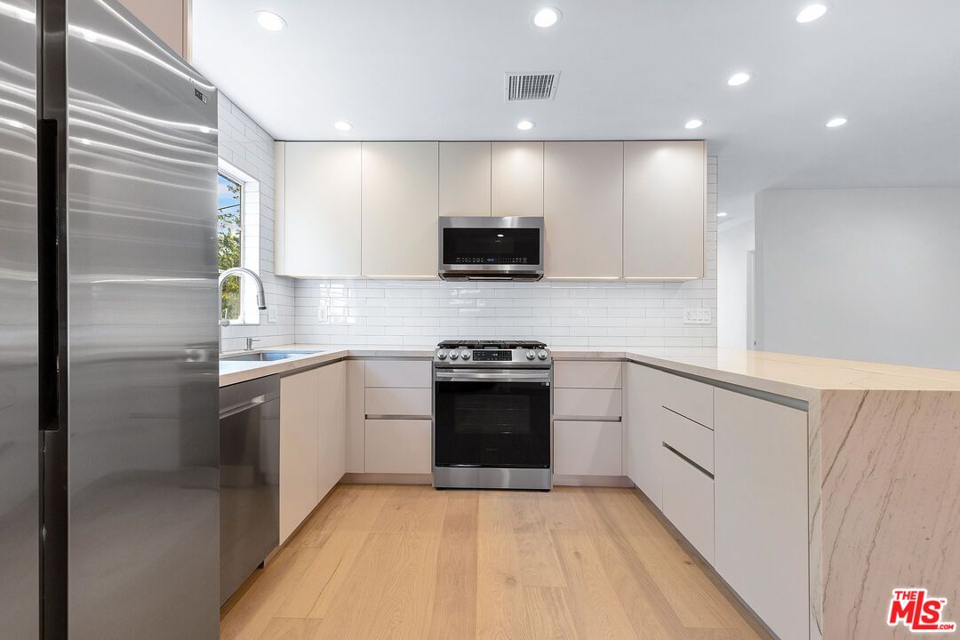 Interior, Kitchen, Recessed Lighting, Stainless Steel Appliances, Wood Texture Flooring