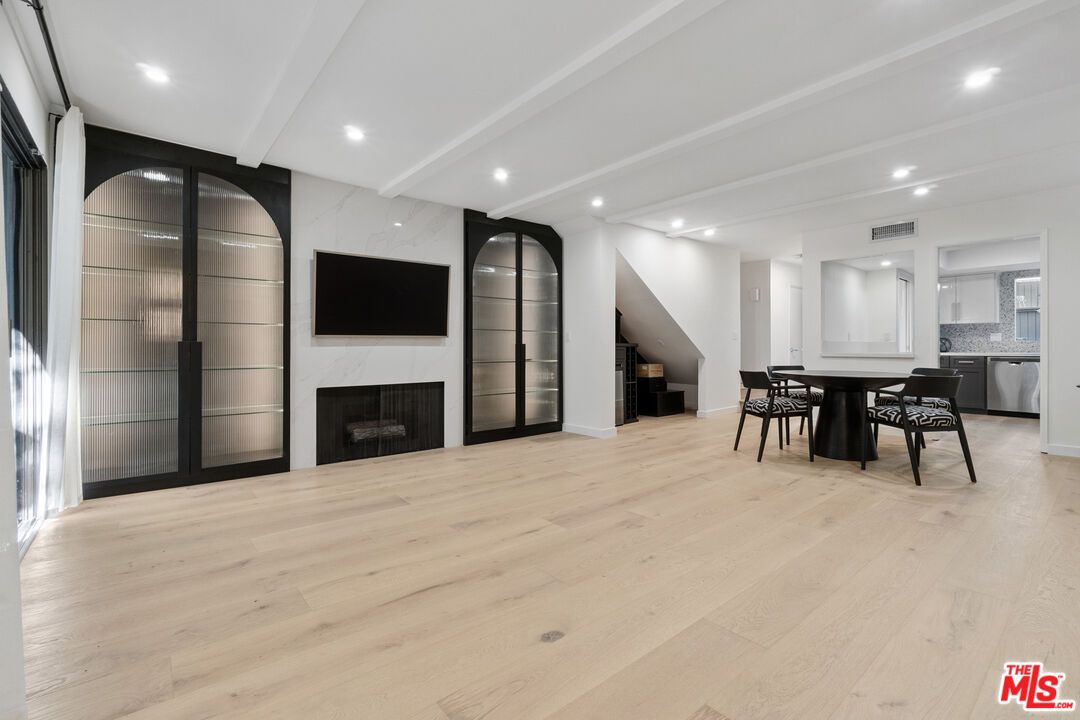 Dining room, Fireplace, Interior, Kitchen, Recessed Lighting, Wood Texture Flooring