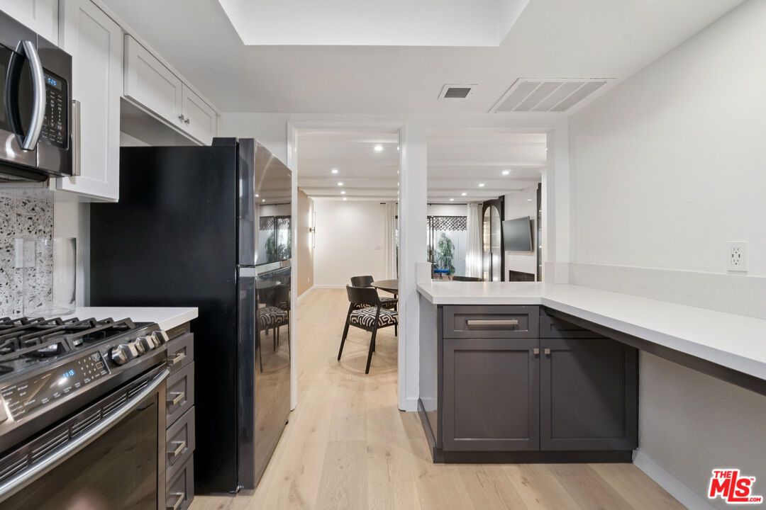 Dining room, Interior, Kitchen, Recessed Lighting, Stainless Steel Appliances, Wood Texture Flooring